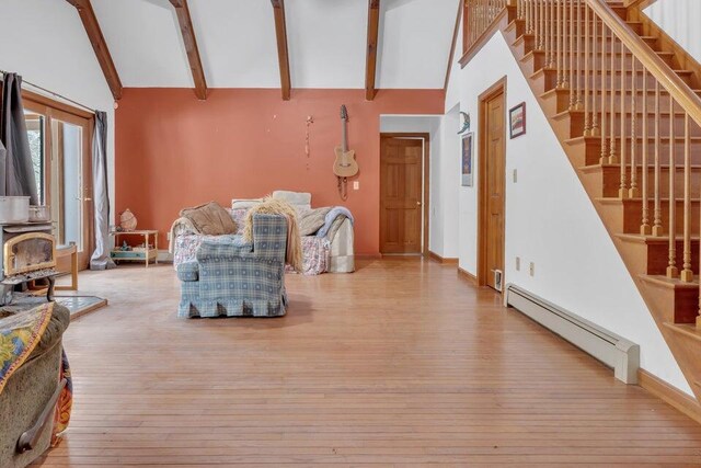 32 Milky Way Ln, Durham, ME 04222 - living room with a baseboard heating unit, hardwood / wood-style flooring, beam ceiling, stairs, and high vaulted ceiling