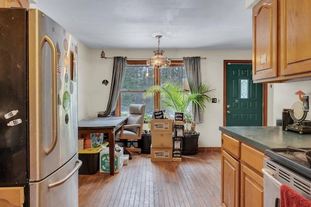 32 Milky Way Ln, Durham, ME 04222 - dining area featuring light wood-style flooring and a chandelier