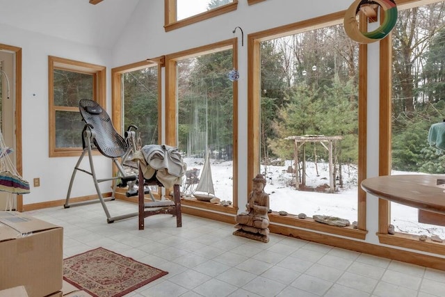 32 Milky Way Ln, Durham, ME 04222 - unfurnished sunroom with plenty of natural light, tile patterned flooring, vaulted ceiling, and baseboards