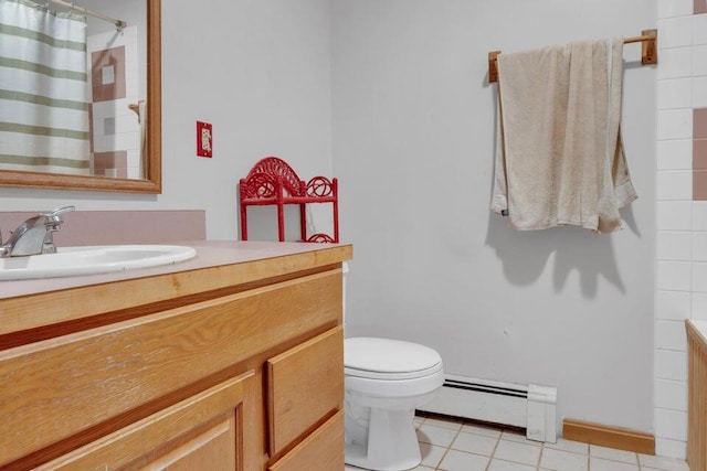 32 Milky Way Ln, Durham, ME 04222 - full bathroom featuring a baseboard heating unit, vanity, toilet, and tile patterned flooring