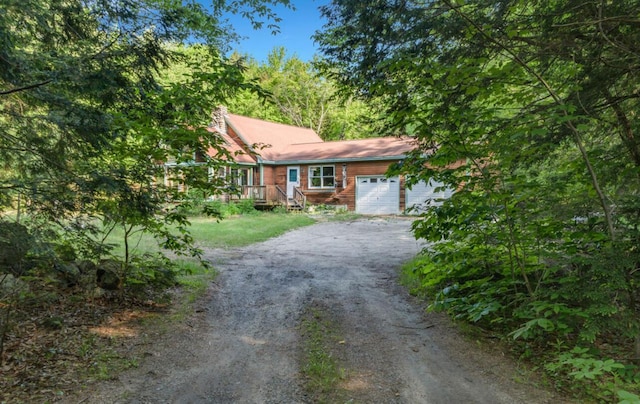 32 Milky Way Ln, Durham, ME 04222 - view of front of home with dirt driveway and a garage