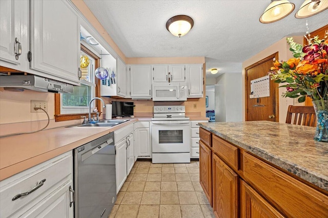 2 Blueberry Pines Dr, Kennebunk, ME 04043 - kitchen featuring white appliances, a sink, white cabinets, a textured ceiling, and light countertops