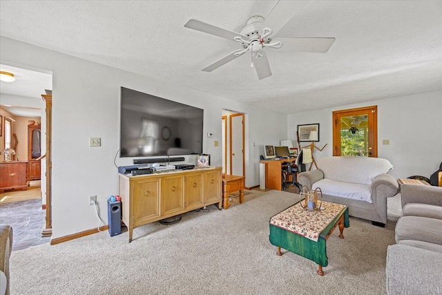 2 Blueberry Pines Dr, Kennebunk, ME 04043 - living room with light colored carpet, ceiling fan, a textured ceiling, and baseboards