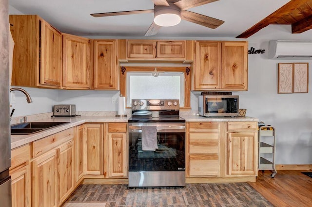 41 Sunny Ln, Sanford, ME 04073 - kitchen with appliances with stainless steel finishes, a wall unit AC, a sink, and light countertops