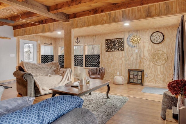 41 Sunny Ln, Sanford, ME 04073 - living room featuring wood walls, wooden ceiling with exposed beams, wood finished floors, and baseboards
