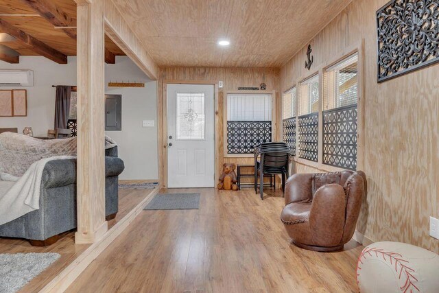 41 Sunny Ln, Sanford, ME 04073 - foyer with wooden ceiling, electric panel, a wall unit AC, and wood finished floors