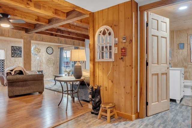 41 Sunny Ln, Sanford, ME 04073 - living area with wooden walls, a ceiling fan, wood finished floors, and beam ceiling
