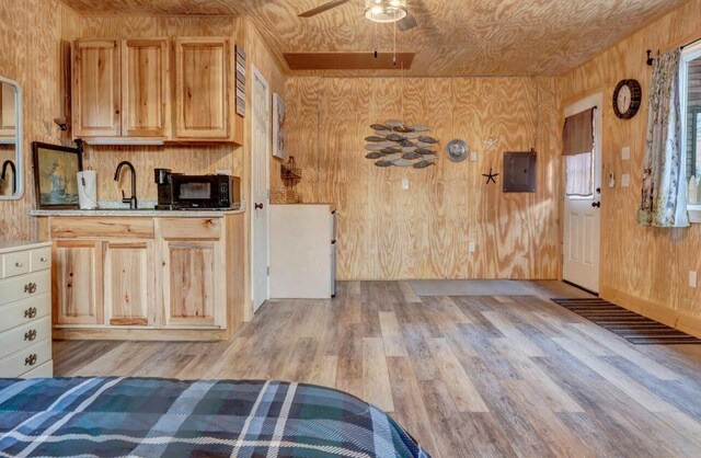 41 Sunny Ln, Sanford, ME 04073 - kitchen featuring electric panel, light wood-type flooring, black microwave, ceiling fan, and a sink