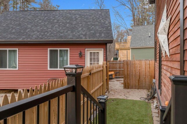 41 Sunny Ln, Sanford, ME 04073 - back of house with roof with shingles and a fenced backyard