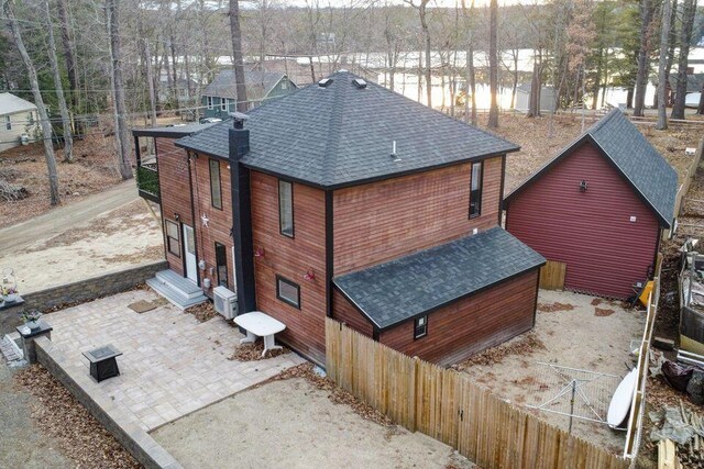 41 Sunny Ln, Sanford, ME 04073 - back of property featuring a shingled roof and a patio area