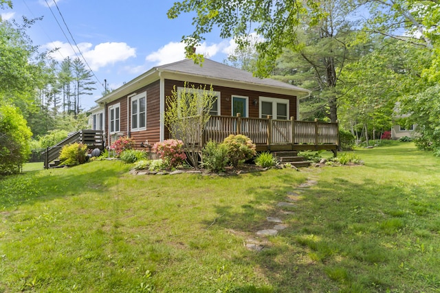 82 Littlefield Rd, Wells, ME 04090 - back of house featuring a deck and a yard