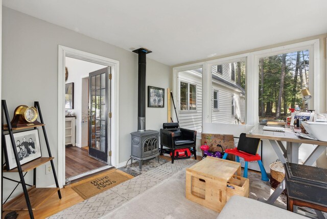47 Old Post Ln, Sanford, ME 04073 - sunroom / solarium featuring a wood stove