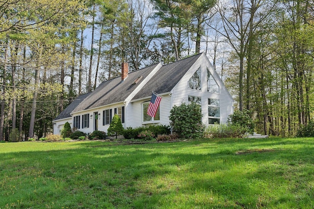 47 Old Post Ln, Sanford, ME 04073 - view of front of house with a chimney, a garage, and a front yard