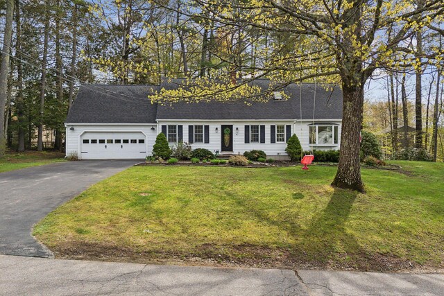 47 Old Post Ln, Sanford, ME 04073 - view of front of property featuring asphalt driveway, a garage, a shingled roof, and a front lawn