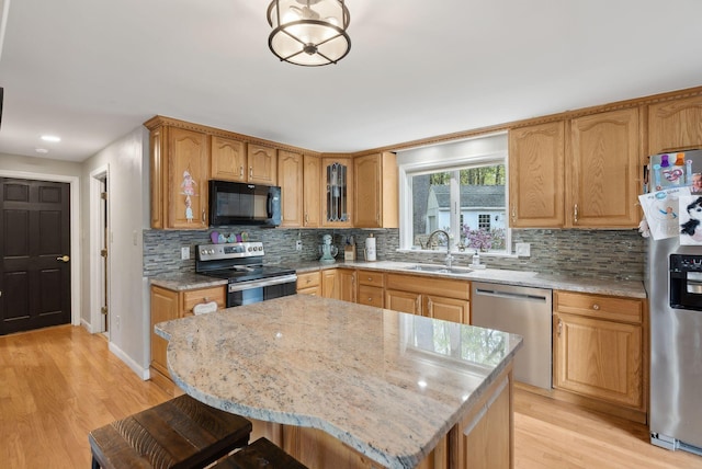 47 Old Post Ln, Sanford, ME 04073 - kitchen with appliances with stainless steel finishes, a sink, light stone countertops, decorative backsplash, and recessed lighting