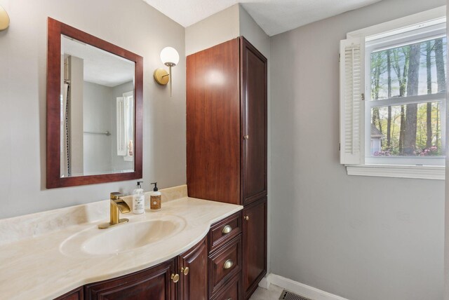 47 Old Post Ln, Sanford, ME 04073 - bathroom with vanity and baseboards