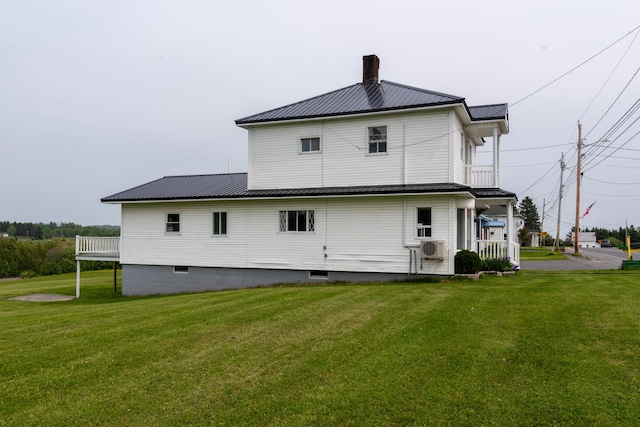 982 Main St, Grand Isle, ME 04746 - rear view of property with a yard, metal roof, and crawl space