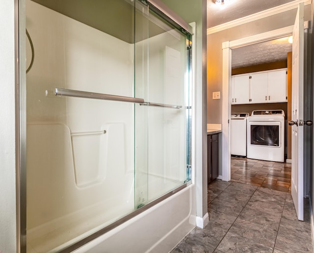 982 Main St, Grand Isle, ME 04746 - full bathroom featuring separate washer and dryer, baseboards, crown molding, vanity, and enclosed tub / shower combo