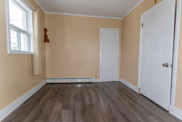 982 Main St, Grand Isle, ME 04746 - unfurnished bedroom featuring baseboard heating, crown molding, wood finished floors, and baseboards