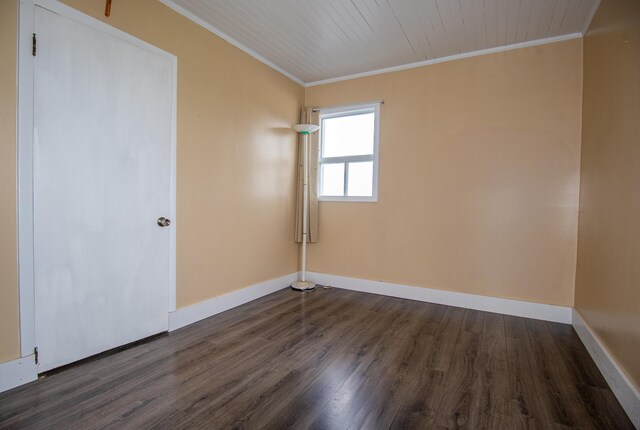 982 Main St, Grand Isle, ME 04746 - unfurnished bedroom with crown molding, dark wood-type flooring, and baseboards