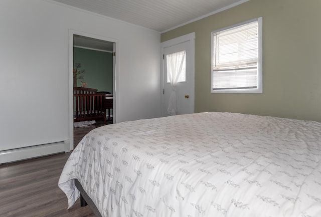 982 Main St, Grand Isle, ME 04746 - bedroom featuring crown molding, dark wood finished floors, and baseboard heating