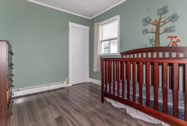 982 Main St, Grand Isle, ME 04746 - unfurnished bedroom featuring crown molding, a baseboard heating unit, wood finished floors, and baseboards