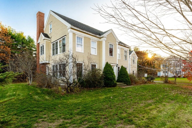 8 Days Lndg, Biddeford, ME 04005 - view of home's exterior featuring a chimney and a lawn