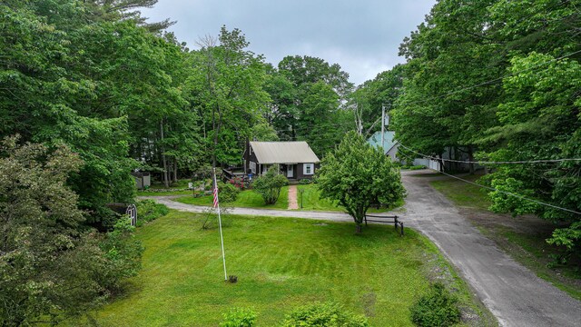 20 Rabbit Ln, Naples, ME 04055 - obstructed view of property featuring a front yard and asphalt driveway