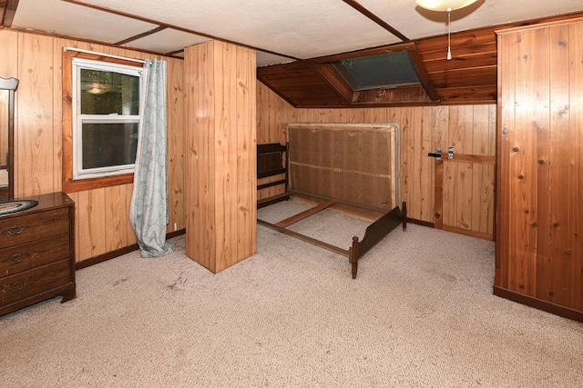 20 Rabbit Ln, Naples, ME 04055 - unfurnished bedroom featuring wood walls and carpet flooring