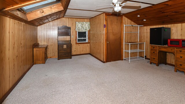 20 Rabbit Ln, Naples, ME 04055 - bonus room featuring vaulted ceiling, wood walls, ceiling fan, a skylight, and carpet floors