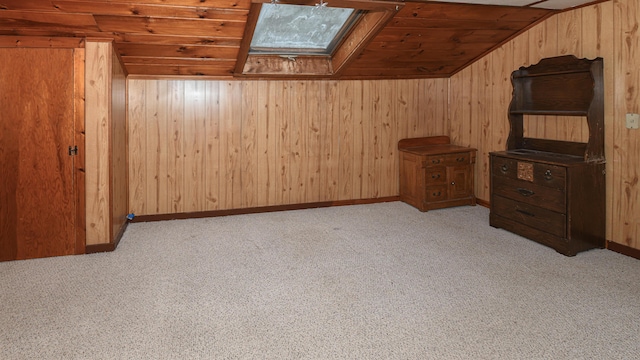 20 Rabbit Ln, Naples, ME 04055 - bonus room featuring wood ceiling, wood walls, vaulted ceiling, a skylight, and light colored carpet