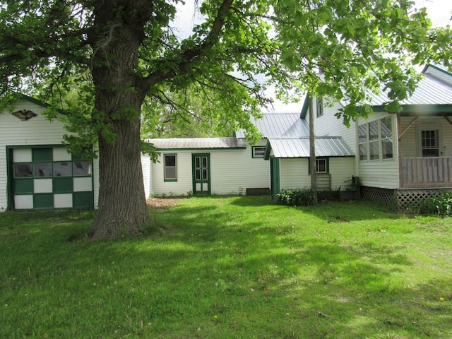 25 Moores Mill Rd, Canaan, ME 04924 - view of green lawn featuring a garage