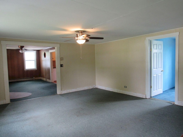 25 Moores Mill Rd, Canaan, ME 04924 - empty room with a ceiling fan, dark carpet, baseboard heating, and baseboards
