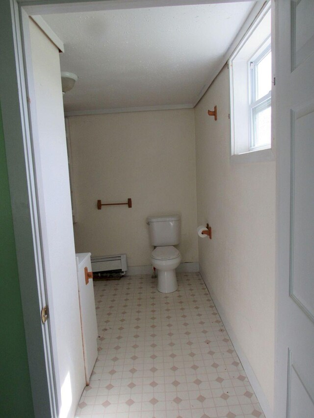 25 Moores Mill Rd, Canaan, ME 04924 - bathroom featuring tile patterned floors, a baseboard radiator, and toilet