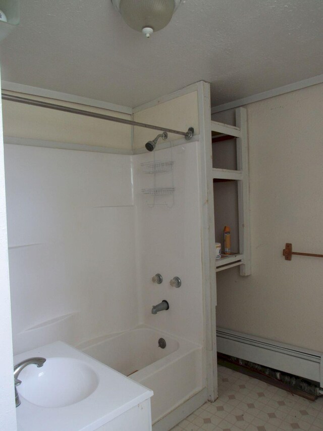 25 Moores Mill Rd, Canaan, ME 04924 - bathroom with  shower combination, baseboard heating, tile patterned floors, and vanity