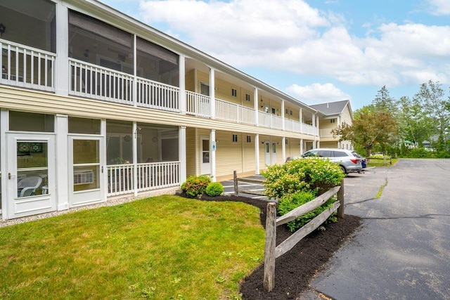 1762 Post Rd Unit 115, Wells, ME 04090 - view of property featuring uncovered parking