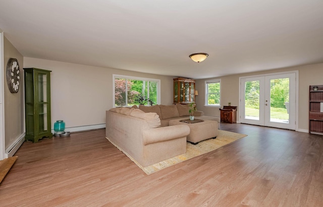 59 Milton Mills Rd, Lebanon, ME 04027 - living area with baseboard heating, wood finished floors, and french doors