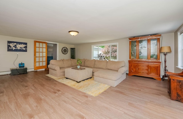 59 Milton Mills Rd, Lebanon, ME 04027 - living room with wood finished floors and a baseboard radiator