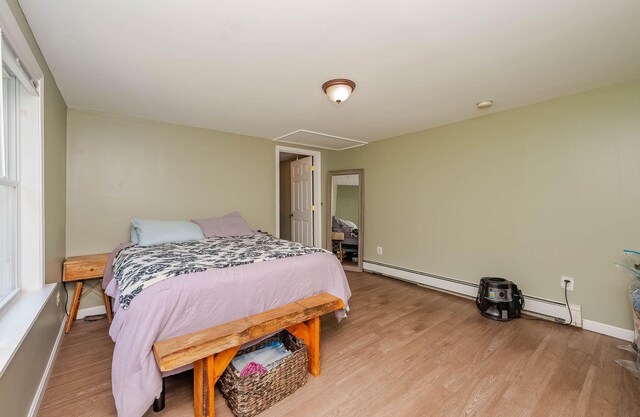 59 Milton Mills Rd, Lebanon, ME 04027 - bedroom with attic access, light wood finished floors, baseboards, and baseboard heating