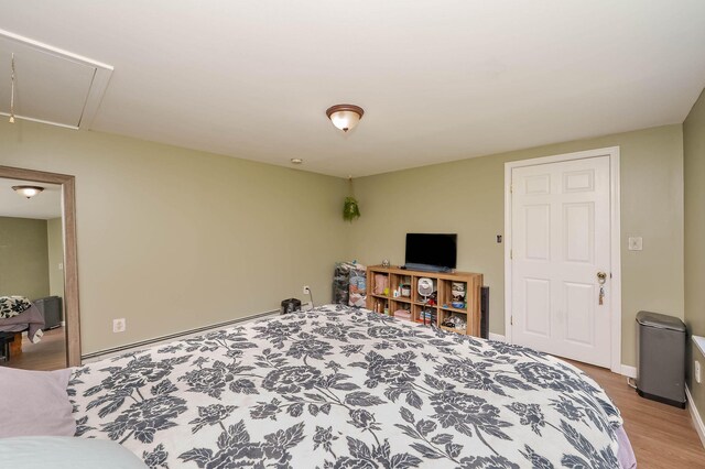 59 Milton Mills Rd, Lebanon, ME 04027 - bedroom with attic access, light wood-style flooring, and baseboards