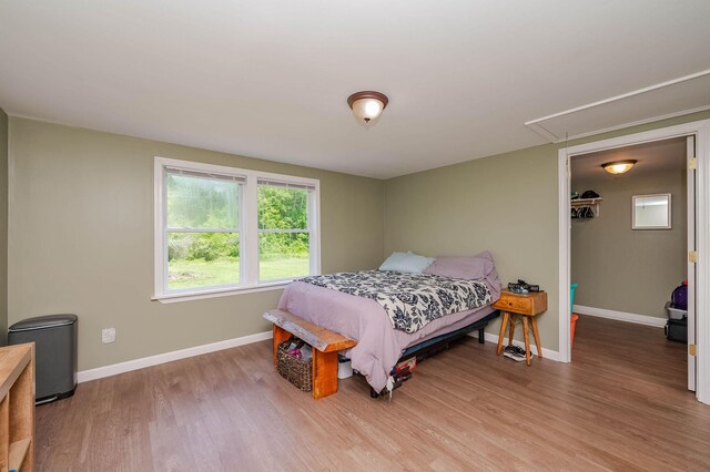 59 Milton Mills Rd, Lebanon, ME 04027 - bedroom with attic access, wood finished floors, and baseboards