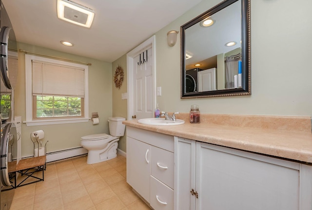 59 Milton Mills Rd, Lebanon, ME 04027 - bathroom featuring a baseboard radiator, vanity, toilet, baseboards, and recessed lighting