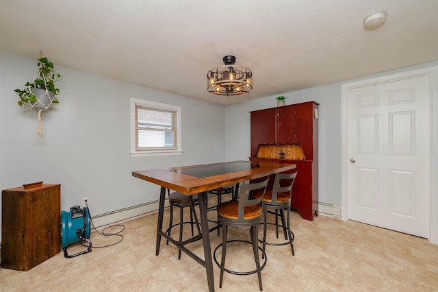 59 Milton Mills Rd, Lebanon, ME 04027 - dining space with baseboard heating, a baseboard heating unit, a chandelier, and light flooring