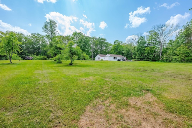 59 Milton Mills Rd, Lebanon, ME 04027 - view of grassy yard featuring view of wooded area