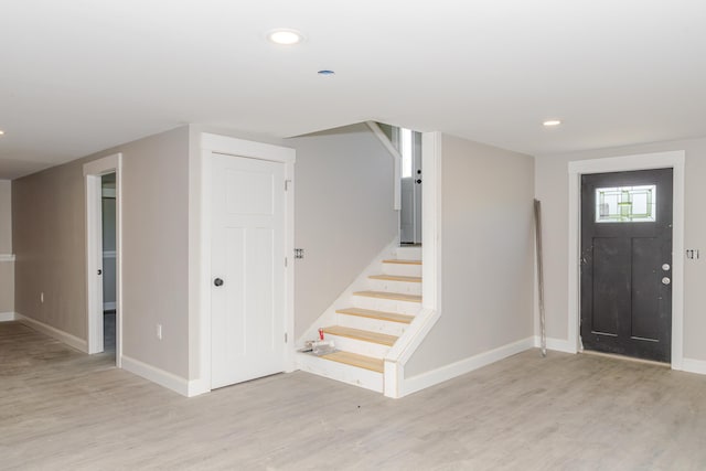 44 Bailey Rd, Cambridge, ME 04923 - entrance foyer featuring light wood-style floors, stairs, baseboards, and recessed lighting