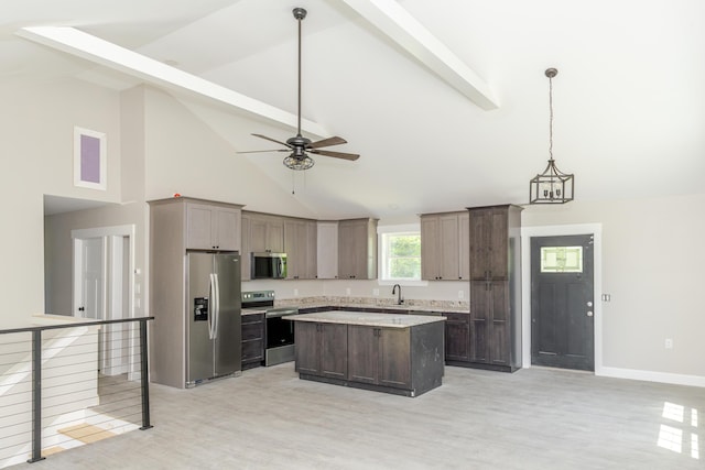 44 Bailey Rd, Cambridge, ME 04923 - kitchen with stainless steel appliances, light countertops, a center island, a sink, and high vaulted ceiling
