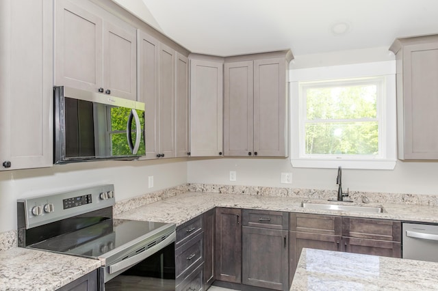 44 Bailey Rd, Cambridge, ME 04923 - kitchen featuring appliances with stainless steel finishes, a sink, and light stone counters