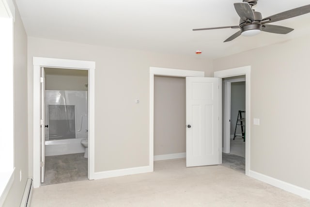 44 Bailey Rd, Cambridge, ME 04923 - unfurnished bedroom featuring baseboard heating, baseboards, a closet, and ensuite bath