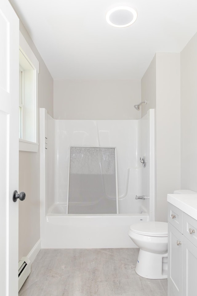 44 Bailey Rd, Cambridge, ME 04923 - bathroom with a baseboard radiator, toilet, shower / washtub combination, and vanity
