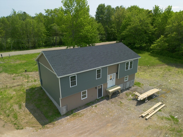 44 Bailey Rd, Cambridge, ME 04923 - view of front facade featuring a shingled roof and a view of trees
